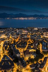 Dusk Delights: Aerial Hyperlapse of Lausanne Cityscape with Lake Geneva in Full 4K image