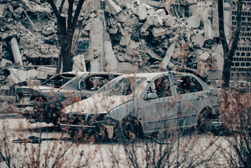 damaged and looted cars in a city in Ukraine during the war