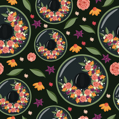 festive seamless pattern for Mexican Cinco de Mayo holiday, namely black sombrero decorated with various flowers and green leaves on dark background, for poster, packaging or textile