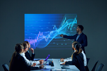 Team members sitting in boardroom setting, reviewing digital stock chart on screen as part of a business discussion. Financial investment. Concept of business, trade market, economics, finances - obrazy, fototapety, plakaty