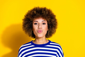 Portrait of pretty young woman pouted lips kiss wear striped shirt isolated on yellow color background - obrazy, fototapety, plakaty