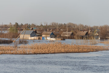 Flood in Kazakhstan. Flooded houses in a dacha area. The river overflowed its banks. Cataclysms in...