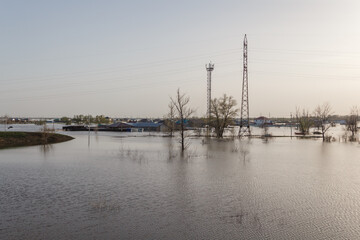 Flood in Kazakhstan. A village flooded with water. The river overflowed its banks. Melt water in...