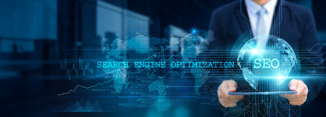 Search engine optimization (SEO), Businessman use tablet and SEO tools with the structure of SEO strategies on the network for working in futuristic business, technology, and website development.