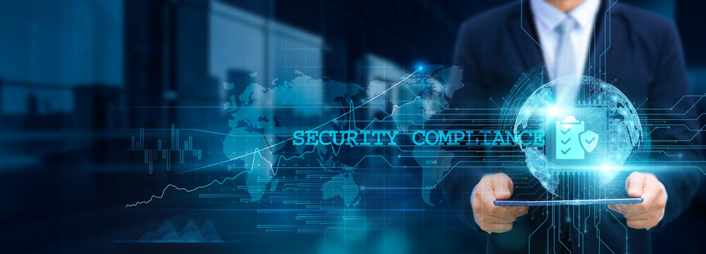 Security compliance, ensuring confidentiality, Businessman using tablet and ensuring compliance with the structure of security protocols on the network for working in futuristic security and integrity