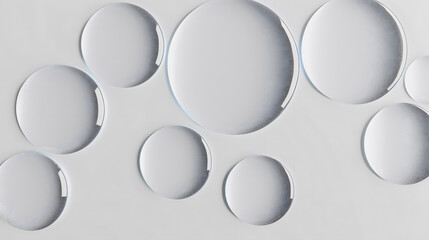 A visual exploration of space and light through an arrangement of floating transparent bubbles on a pure white backdrop.