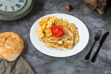 Chicken with potatoes: A hearty and satisfying dish featuring tender chicken pieces roasted or grilled alongside seasoned potatoes, offering a flavorful and comforting meal.