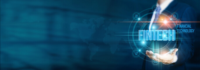 Businessman hand-holding fintech (financial technology) icons with innovative solutions and network connections. Facilitating the growth of digital finance, online transactions, business operations.