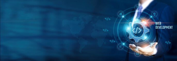 Businessman hand-holding web development and coding icons with digital innovation and network connection. Leading the growth of online presence and expanding business.