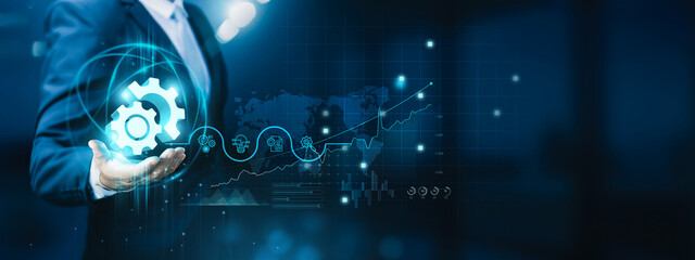 Businessman hand-holding engineering innovation, technology, development, and teamwork icons with...