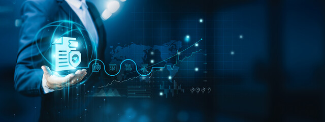 Businessman hand-holding security compliance icons with a secure network connection. Ensuring the growth of the organization's security and compliance for a robust and resilient business environment.