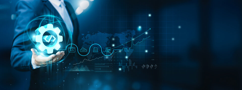 Businessman hand-holding software development, coding, innovation, and teamwork icons with a digital network connection. Facilitating the growth of the tech industry, startups, established businesses.