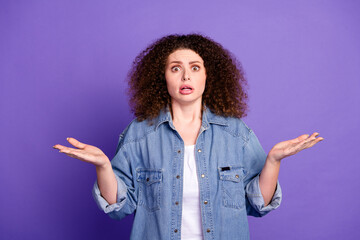Photo of cool nice girl stare shrug shoulders wear denim shirt isolated on violet color background
