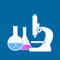 microscope and flasks with chemical reagents