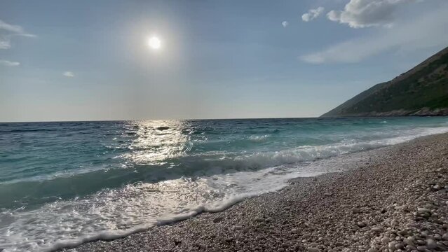 Rocky beach and crystal turquoise water of Ionian Sea in Albania