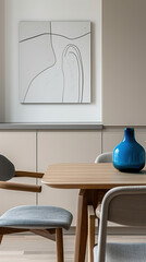 A minimalist modern dining room with an elegant wooden table and chairs in gray and black tones, featuring wall art of abstract line drawings. A blue vase sits on the side of one chair.