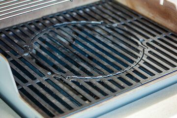 Cast iron barbecue grill to clean. - obrazy, fototapety, plakaty