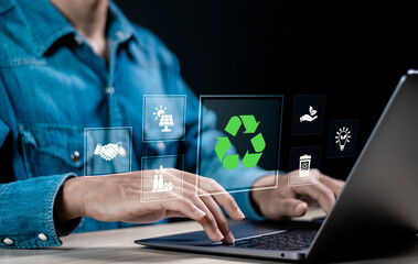 ESG environmental, social and governance. Person using laptop with ESG icon on virtual screen for world sustainable environment concept.
