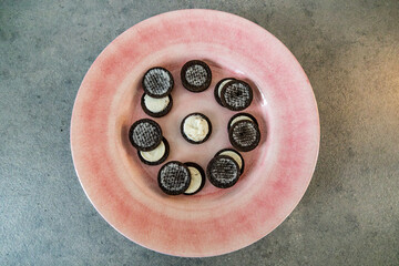 Lunar phases illustrated with cream cookies.