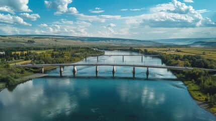 Fototapeta premium A bridge spanning a wide river, symbolizing connectivity and the vital role of rivers as natural conduits for transportation and commerce.