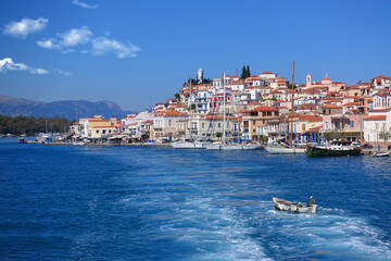 Fototapeta na wymiar Famous main picturesque village of Poros island featuring clock tower, Saronic Gulf, Greece