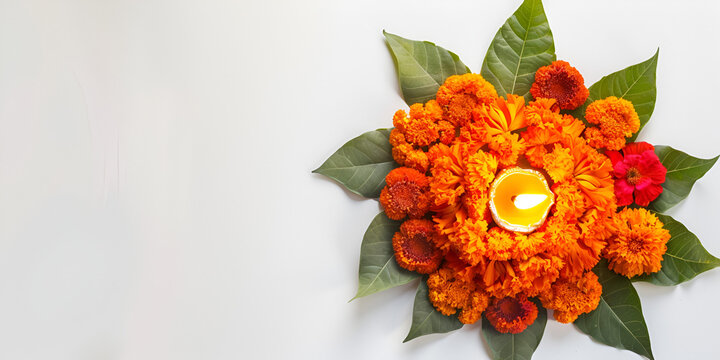 Marigold Flower Rangoli Design for Diwali Festival  Festival flower decoration Pongal made using marigold or zendo flowers and red rose petals over white background with Clay Oil Lamp in the middle.