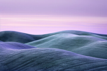 Tranquil Lavender Dusk over Rolling Hills in Pastoral Landscape
