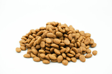 Close up of dry pet food on white background.