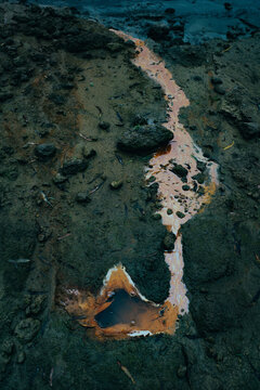 Oily water of an unknown origin bubbles from the mud of the Mississippi River south of Helena, Mississippi