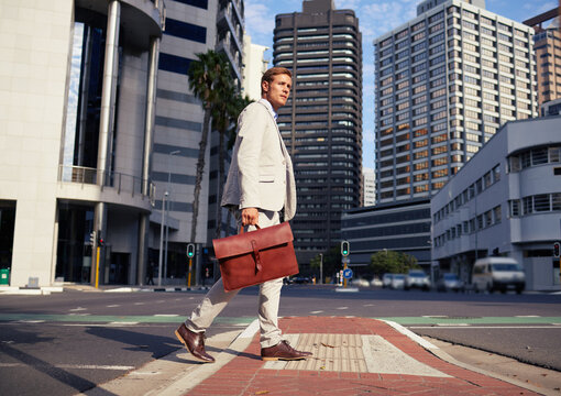 Businessman, thinking and walking for commute in city, corporate career and office building. Executive, briefcase and sustainable travel by urban street with professional job and suit in South Africa