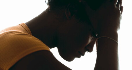 Candid Lonely Young Woman Struggling with Depression – Pensive Profile Close-Up of Person Holding...