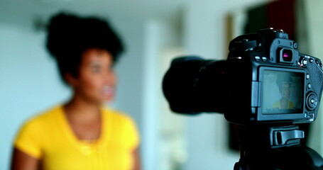 Energetic Young Black Female Vlogger Sharing Insights on Camera for Web Channel, 20s Content...