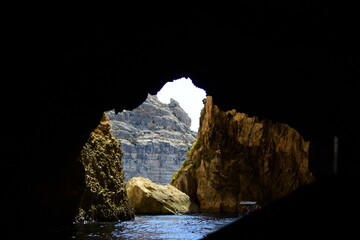 ZURRIEQ, MALTA - Augusts 06, 2021: The Blue Grotto - A famous sea cave surrounded by the deep blue...