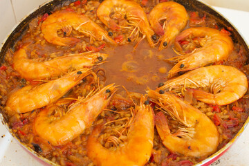 Adding Fried Shrimp to Paella Culinary Harmony