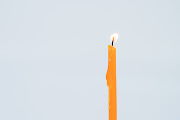 yellow candle flame  on white background