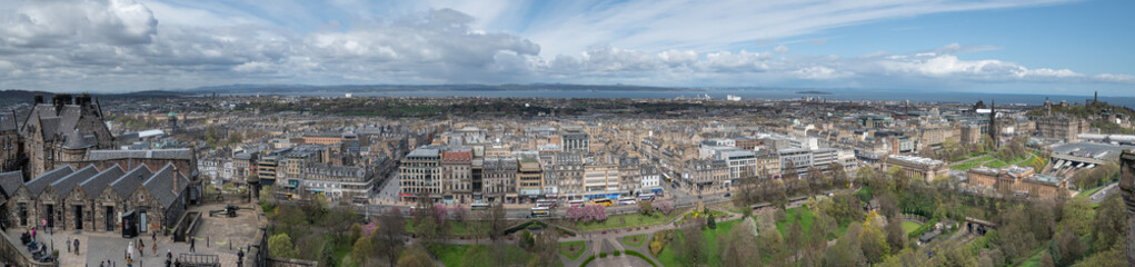 Panorama of Edinburgh Skyline including Carlton Hill, the St James Quarter building, the 1 O'Clock gun with the Firth of Forth in the distance