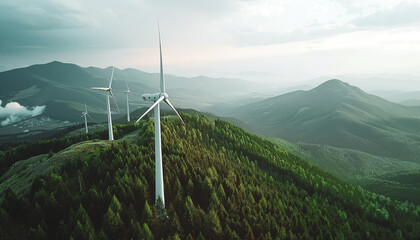 Wind turbines on top of a forested mountain, drone footage. Sustainable energy, ecological power production