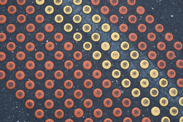 Abstract view of railway station platform with yellow and red tactile safety dots. Melbourne, Australia