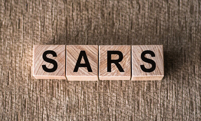 The Word SARS Spelled With Wooden Blocks