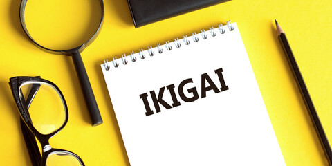 Ikigai Concept Displayed on Notebook Against a Yellow Background