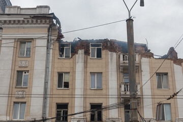 A Russian missile hit a residential building in the city of Dnepr, Ukraine. Damaged apartment building after a massive missile attack on 04/19/24. Scars of war. Consequences of the attack - obrazy, fototapety, plakaty