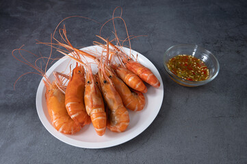 Shrimps grilled thai style, food famous in thailand, local seafood with spicy seafood sauce.