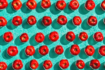 Rolgordijnen Vibrant Pattern of Red Apples on Turquoise Blue Surface Viewed from Above © SHOTPRIME STUDIO