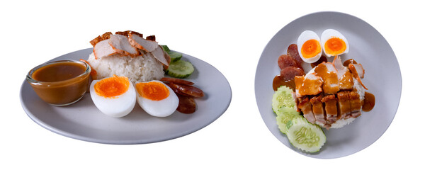 Barbecued red pork, crispy pork belly, boiled egg with rice and red sauce served with cucumber slices.