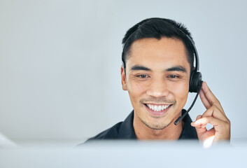 Consulting, phone call and man in office for customer service, telemarketing and headset at callcenter. Happy advisor, salesman or virtual assistant in client care, tech support or help desk for crm