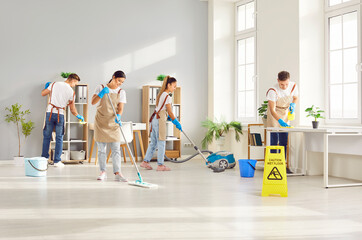 Cleaner group working, happy workers with tools, professional janitor service busy cleaning home,...