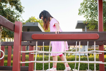 Cute asian girl playing in the playground - 789472721