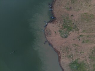 River meets ocean: Aerial view of coastal landscape with sandy beaches, azure waters, and rocky...