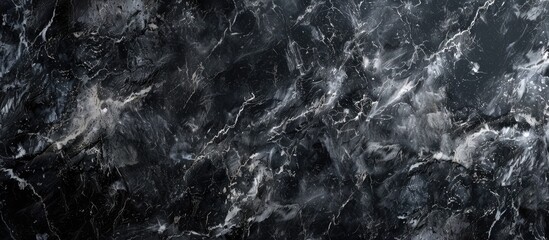 High resolution black marble texture background pattern.