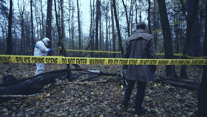 Forensic investigation team collects evidence and takes photos at a crime scene 
